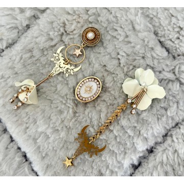 Boucles d'oreilles buffle asymétrique crème.